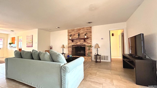 tiled living room featuring a fireplace