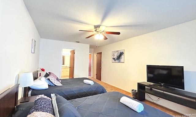 bedroom with ceiling fan and ensuite bath