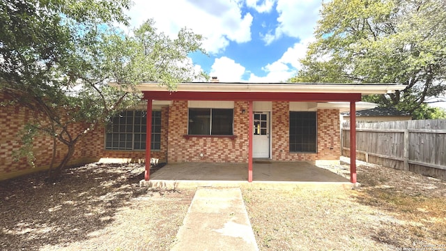 back of house with a patio