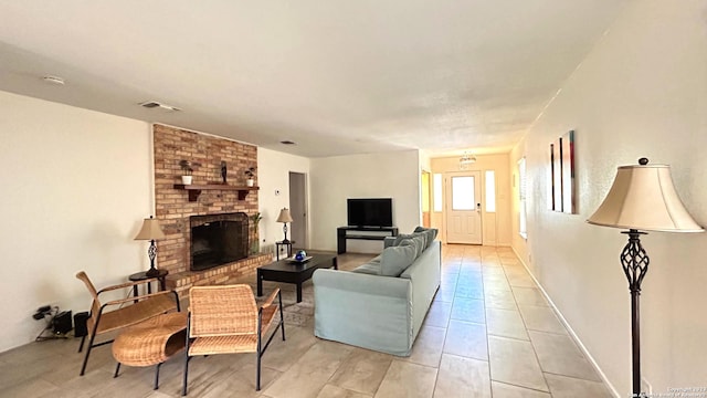 tiled living room featuring a fireplace