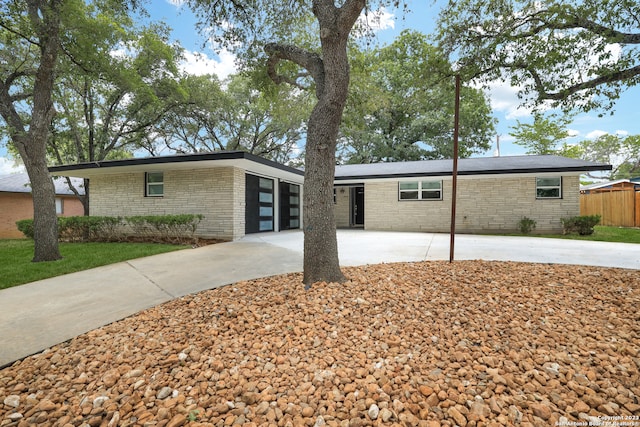 ranch-style home with a patio area