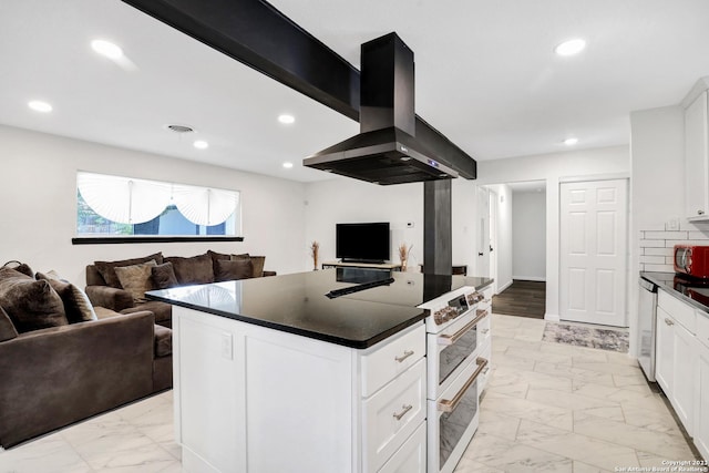 kitchen featuring dishwashing machine, a center island, white cabinets, and island exhaust hood