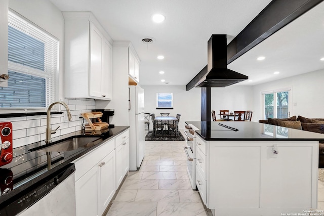 kitchen featuring sink, white cabinets, decorative backsplash, island exhaust hood, and white appliances