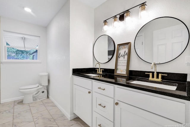 bathroom with vanity and toilet