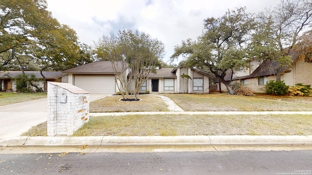 view of front of house with a garage and a front lawn