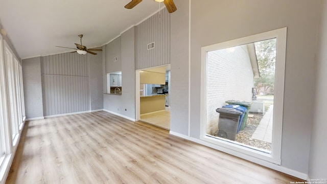 interior space featuring ceiling fan, hardwood / wood-style flooring, and a healthy amount of sunlight