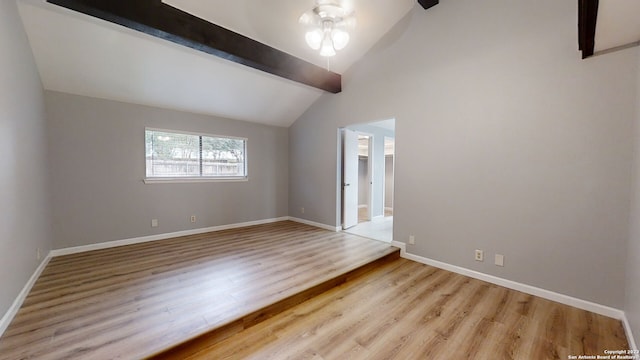 unfurnished room with lofted ceiling with beams, ceiling fan, and light hardwood / wood-style flooring