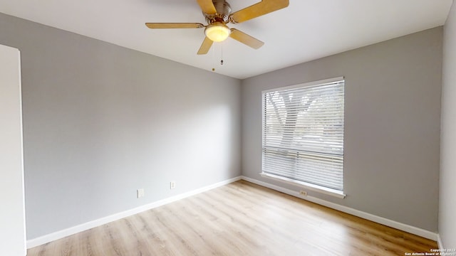 spare room featuring ceiling fan and light hardwood / wood-style flooring