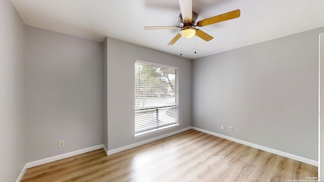 unfurnished room with ceiling fan, a healthy amount of sunlight, and light wood-type flooring