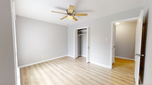 unfurnished bedroom with ceiling fan, a closet, and light hardwood / wood-style flooring