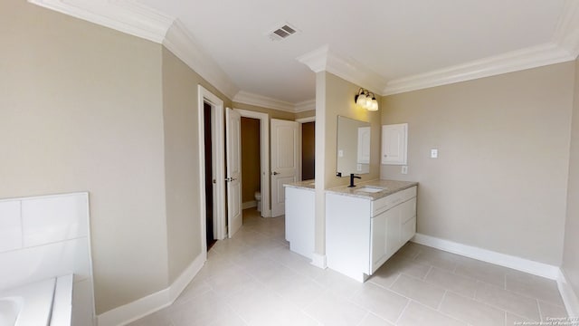 bathroom featuring vanity, tile patterned floors, ornamental molding, and toilet