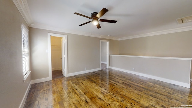 unfurnished room with ceiling fan, crown molding, dark wood-type flooring, and a wealth of natural light