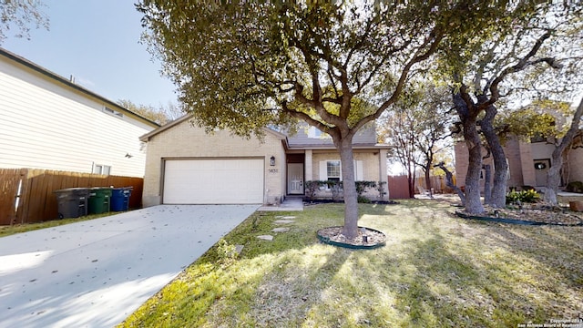 view of front of home with a garage and a front yard