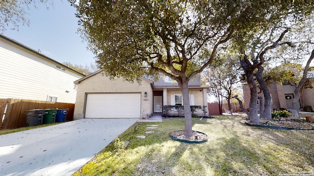 view of front of property featuring a garage and a front yard