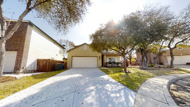 view of front of house with a garage and a front yard