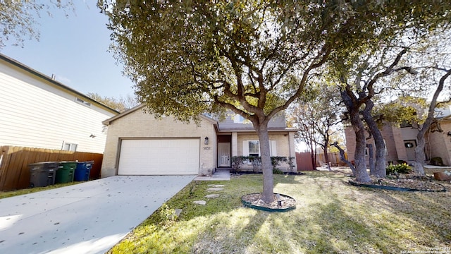 view of front facade featuring a garage and a front lawn