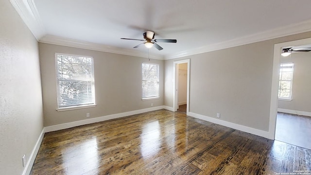 unfurnished room featuring ornamental molding, ceiling fan, and dark hardwood / wood-style flooring