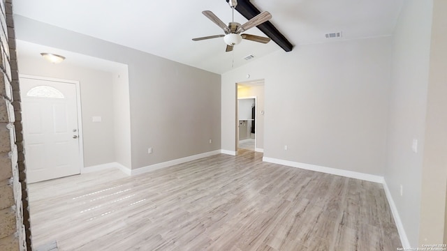 spare room with vaulted ceiling with beams, ceiling fan, and light wood-type flooring