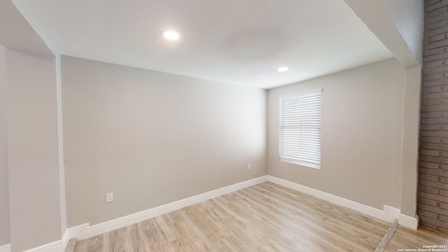 spare room with light hardwood / wood-style floors