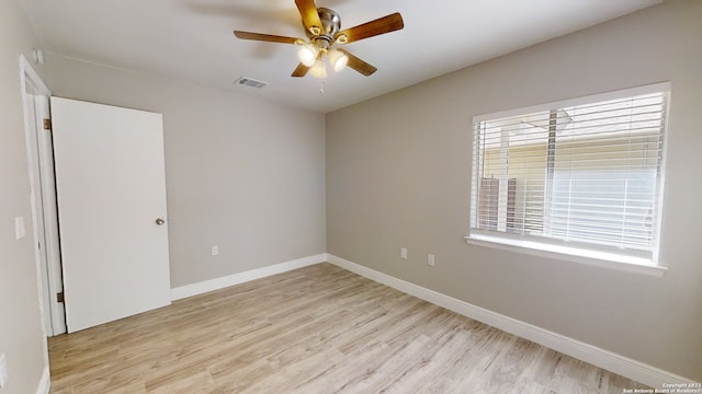 spare room featuring ceiling fan and light hardwood / wood-style floors