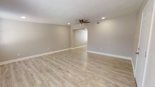 spare room featuring ceiling fan and light hardwood / wood-style flooring