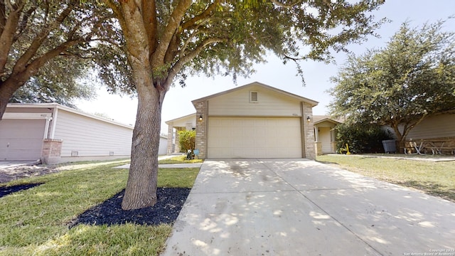 single story home featuring a garage and a front yard