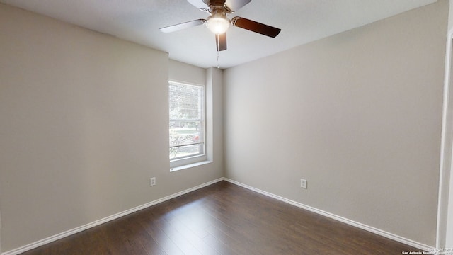 unfurnished room with dark hardwood / wood-style flooring and ceiling fan