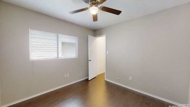 unfurnished room featuring dark hardwood / wood-style floors and ceiling fan