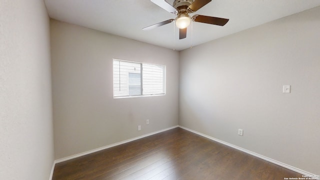 empty room with dark wood-type flooring and ceiling fan