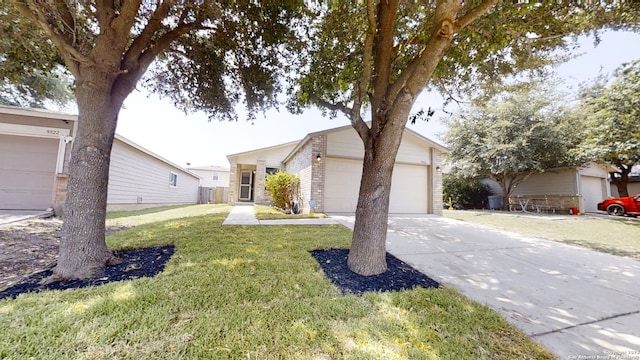 single story home with a garage and a front yard