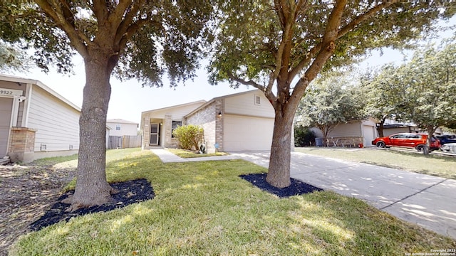 ranch-style home with a garage and a front lawn