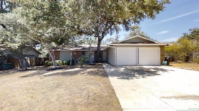 ranch-style house featuring a garage