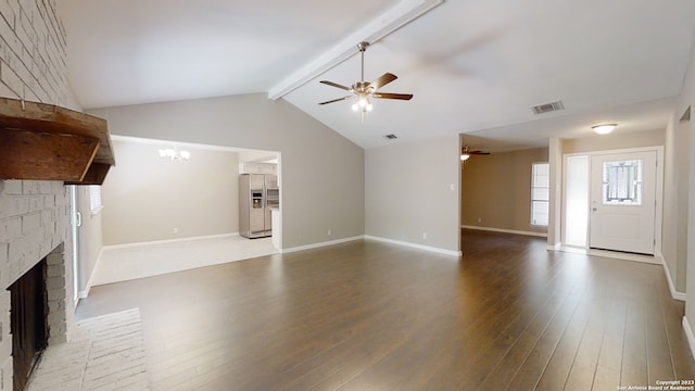 unfurnished living room with a brick fireplace, vaulted ceiling with beams, ceiling fan with notable chandelier, and light hardwood / wood-style flooring