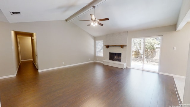 unfurnished living room featuring ceiling fan, dark hardwood / wood-style flooring, lofted ceiling with beams, and a fireplace