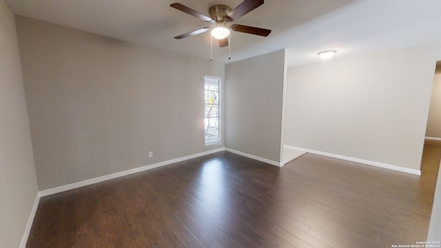 unfurnished room with dark hardwood / wood-style floors and ceiling fan