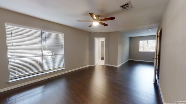 empty room featuring dark hardwood / wood-style floors and ceiling fan