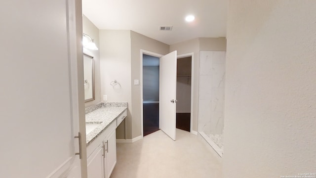 bathroom featuring vanity and walk in shower