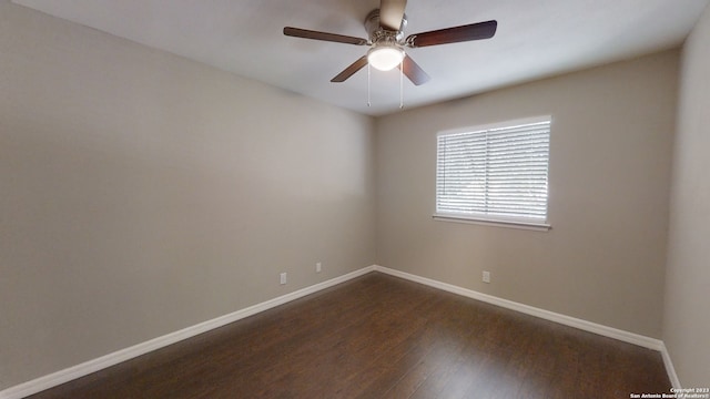 spare room with ceiling fan and dark hardwood / wood-style floors