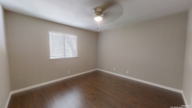 unfurnished room featuring dark wood-type flooring and ceiling fan