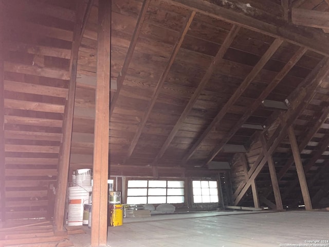 misc room with vaulted ceiling with beams and wooden ceiling