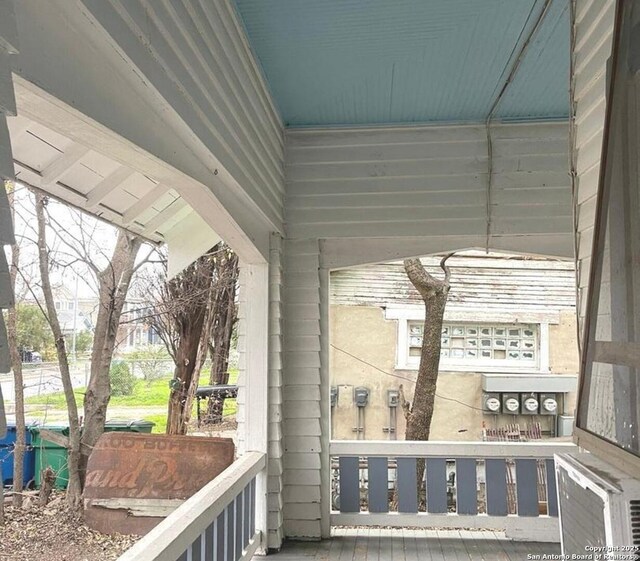 spare room with plenty of natural light and hardwood / wood-style flooring