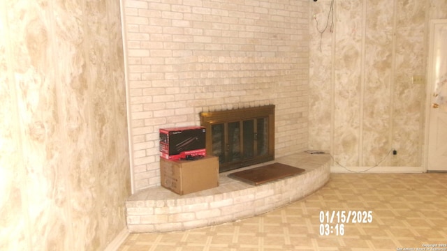 interior details with baseboards and a fireplace