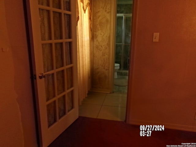 hallway featuring tile patterned floors