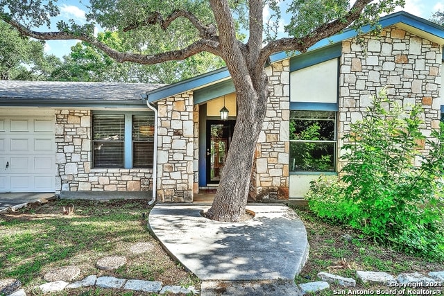 property entrance with a garage