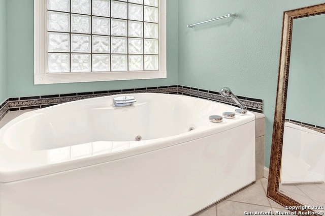 bathroom featuring a tub and tile patterned floors