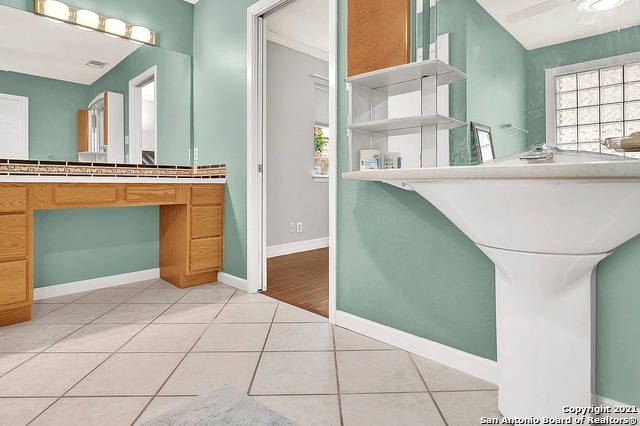 bathroom featuring lofted ceiling, wood-type flooring, and vanity