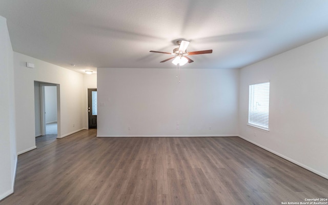 empty room with wood-type flooring and ceiling fan