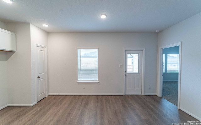 interior space with hardwood / wood-style flooring