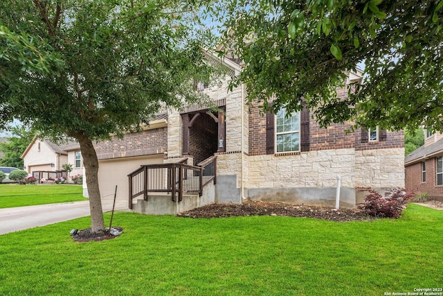 view of front of home with a garage and a front yard