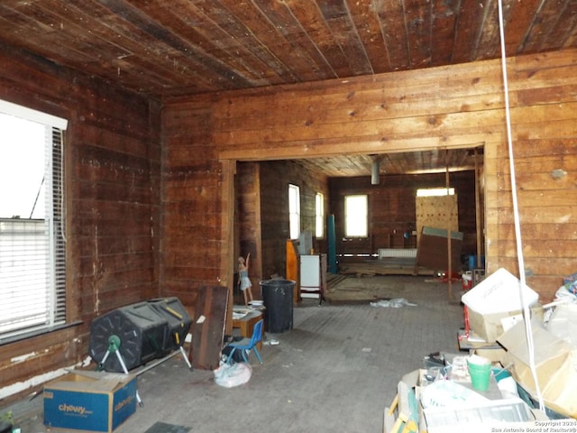 misc room featuring wooden walls and wooden ceiling